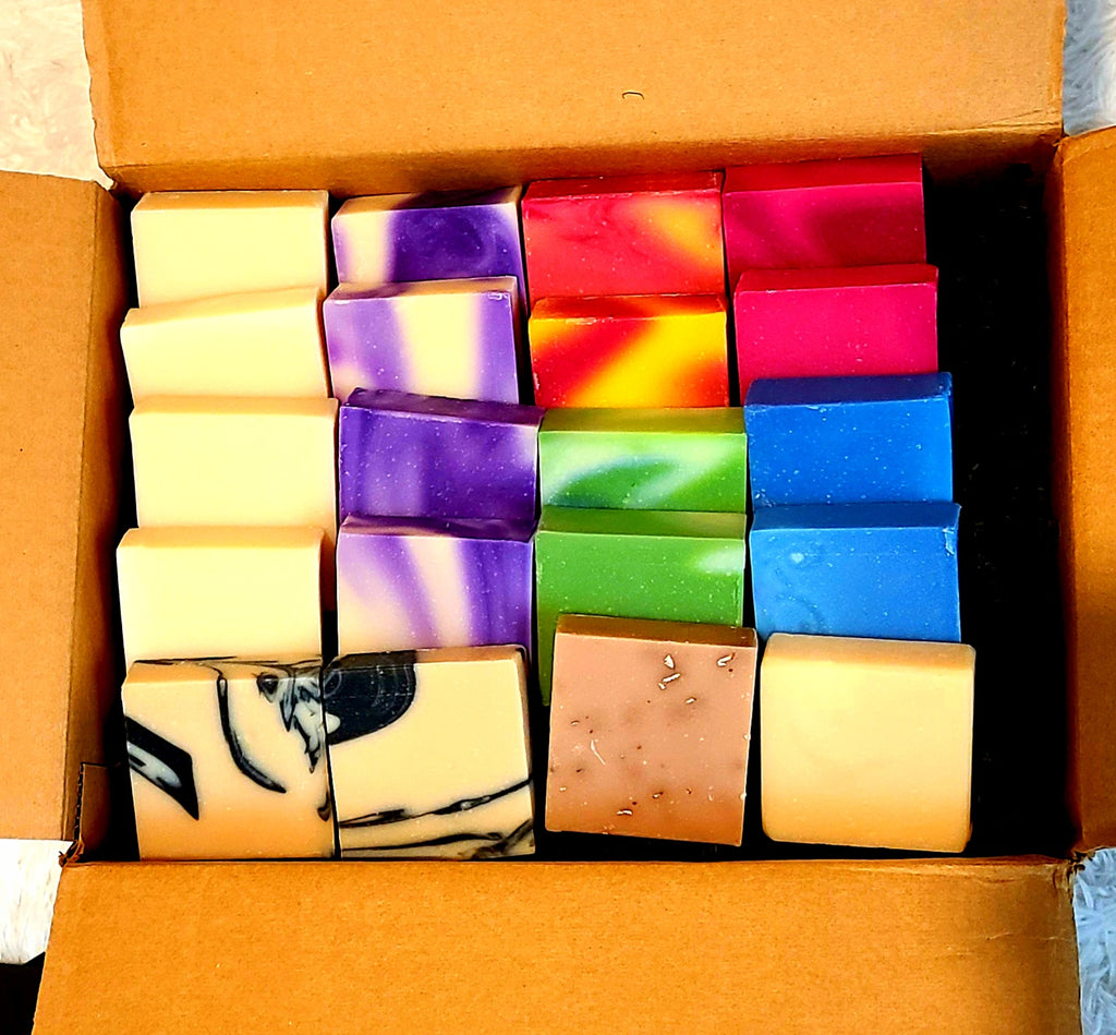 An assortment of bar soaps, ranging from different colours. 